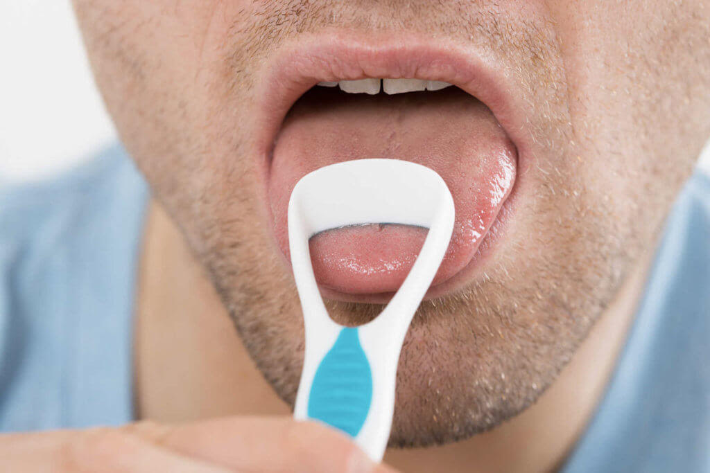 How to Clean Your Tongue Using Tongue Scraper?