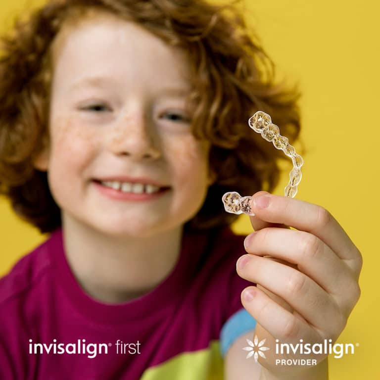 invisalign first kid holding